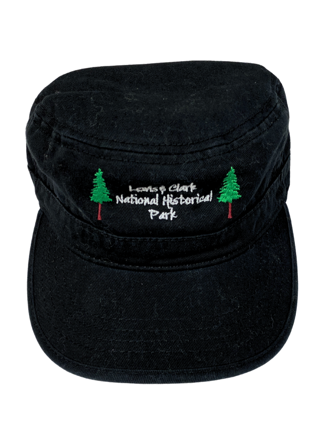 A black cap with a flat top, a modern military style, with two sewn on pine trees and the text in white "Lewis & Clark National Historical Park.